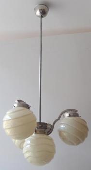 Chandelier made of white metal, with shaped balls Chandelier made of white metal, with shaped balls